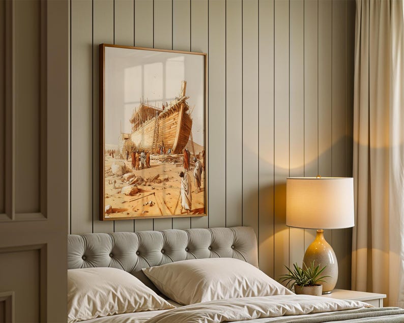 May include: A framed wall art print depicting a large wooden ship under construction in a desert landscape with figures in robes standing nearby. The artwork features warm tan, brown, and beige tones, showcasing detailed craftsmanship of the vessel.