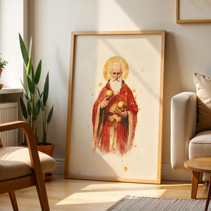May include: A framed vertical wall art print featuring a watercolour-style illustration of an elderly person with a long white beard, wearing a red robe with gold accents, holding two golden spheres, and a golden halo behind their head.