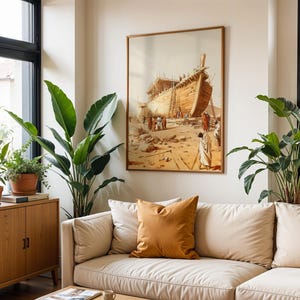 May include: A framed wall art print depicting a large wooden ship under construction in a desert landscape with figures in robes standing nearby. The artwork features warm beige and brown tones, displayed in a room with a beige sofa and plants.