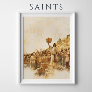 May include: A framed art print titled SAINTS featuring a watercolour-style illustration of a bearded figure in robes holding a basket aloft, surrounded by a crowd of people with raised hands, rendered in warm beige, brown, and muted golden tones.