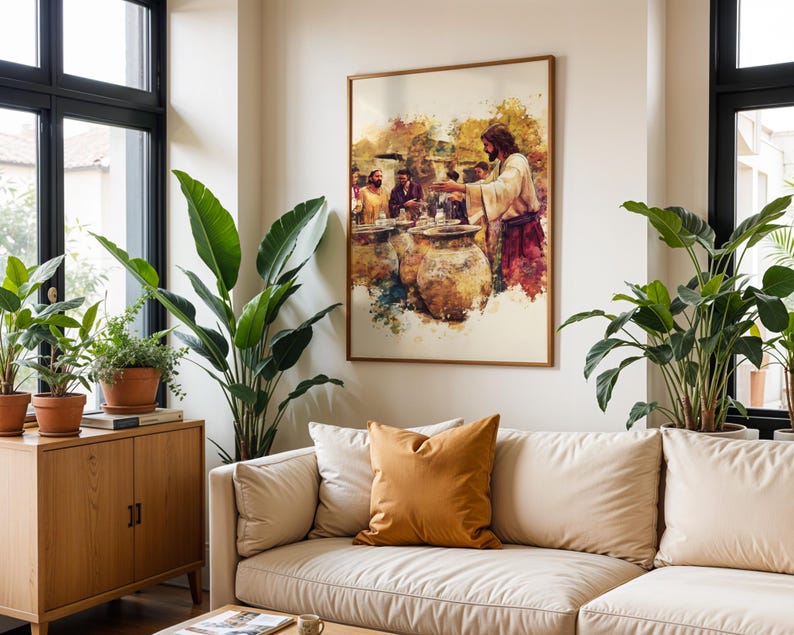 May include: A framed wall art print featuring a watercolor-style illustration of a figure in robes standing before large stone jars, surrounded by other individuals in a warm-toned scene with splashes of yellow, brown, and deep red pigments.