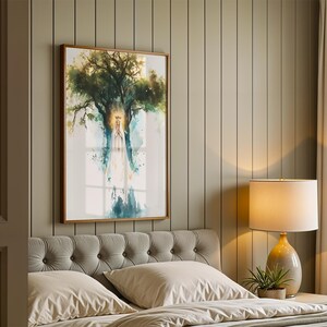 May include: A framed wall art print featuring a watercolour-style illustration of a figure in a long white robe with a golden halo, standing beneath a large, leafy green tree. The artwork uses soft blue and green tones with a bright light effect.