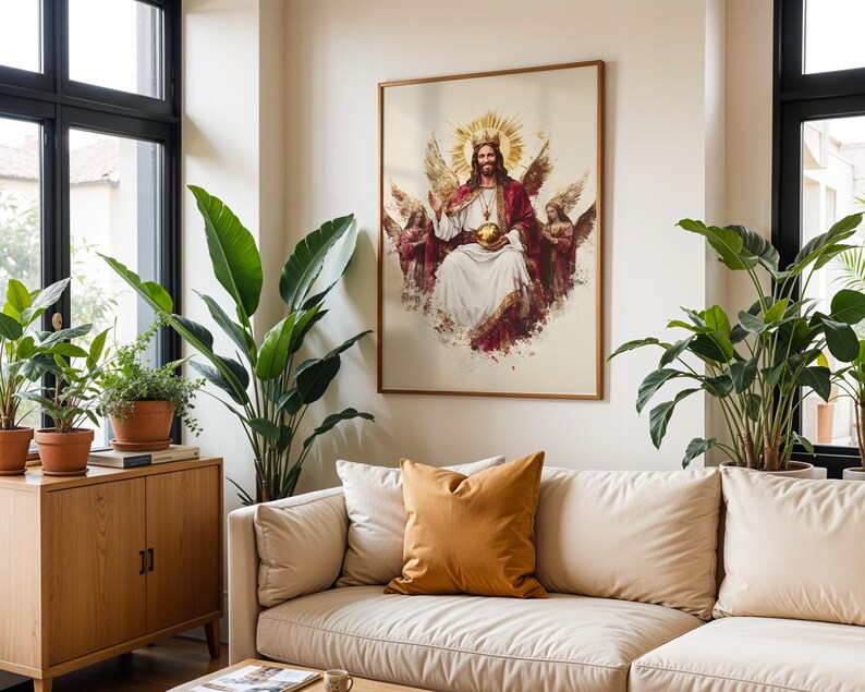 May include: A framed wall art print depicting a central figure with a golden crown and halo, wearing a white robe and red cloak, holding a golden orb, flanked by two winged figures, all rendered in a painterly style with warm tones.