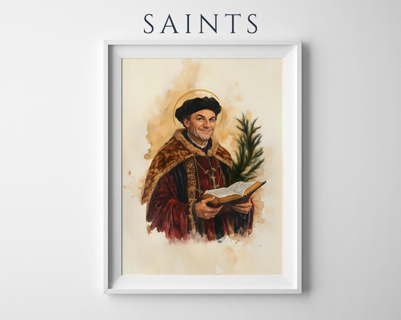 May include: A framed art print titled SAINTS featuring a watercolor-style portrait of a man in a dark cap and red robes with a fur collar, holding an open book and a green palm frond. A thin gold halo circles his head against a beige background.