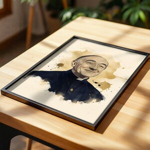 May include: A framed print featuring a watercolor-style portrait of a bald person with a gentle smile, wearing a dark collared shirt with a white clerical collar. The artwork uses beige and brown ink splatters against a light cream background.