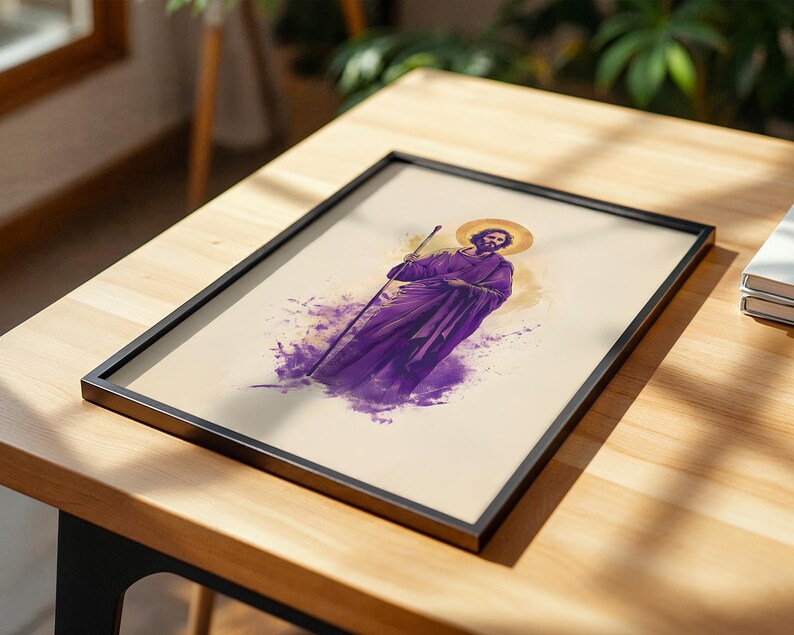 May include: A framed print featuring a stylized illustration of a bearded figure wearing a purple robe and holding a staff. The figure has a golden halo behind their head, set against a cream-colored background with purple watercolor-style accents.