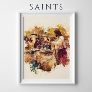 May include: A framed watercolor-style print titled SAINTS, depicting a scene with a central figure in a light robe and dark sash gesturing toward several large, rounded clay pots, surrounded by other figures in a warm, textured color palette.