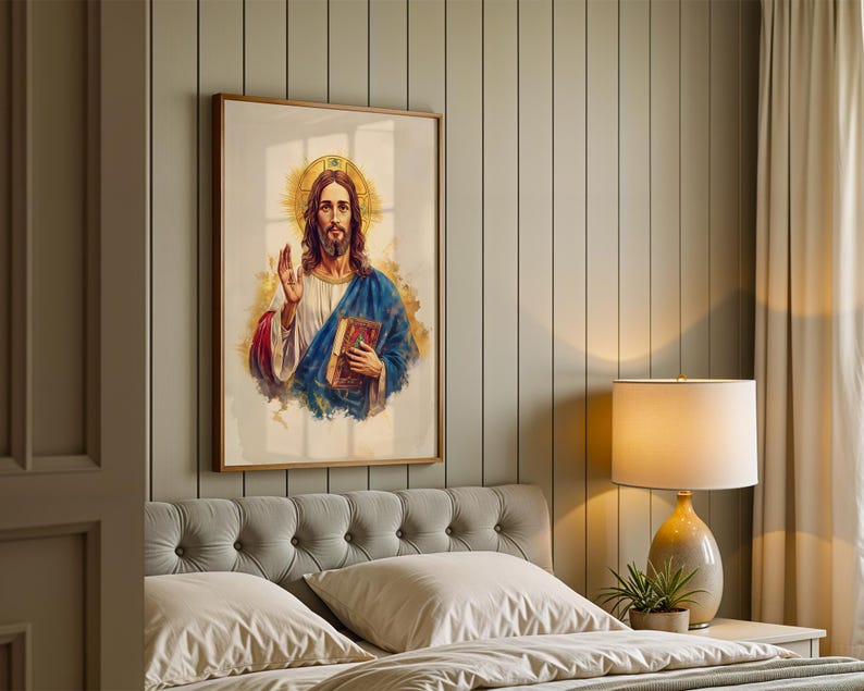 May include: A framed vertical wall art print featuring a watercolor-style illustration of a figure with long brown hair and a beard, wearing a white robe and blue cloak, holding a book, with a golden halo and abstract gold paint splashes.