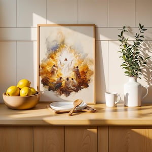 K&ouml;nnte beinhalten: Ein gerahmter Druck im Aquarellstil, der eine zentrale Figur mit erhobenen Armen inmitten eines leuchtenden goldenen Lichts zeigt, umgeben von knienden Gestalten. Das Kunstwerk steht auf einer Holztheke neben einer Schale mit gelben Zitronen.