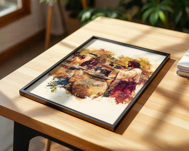 May include: A framed rectangular print featuring a watercolor-style illustration of a bearded figure in a light-colored robe standing at a table with others. The artwork uses warm tones of brown, red, and gold with visible paint splatters.