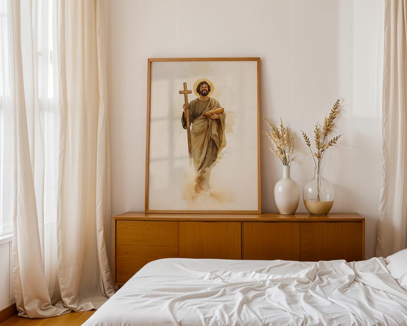 Peut inclure: Une impression d'art encadr&eacute;e repr&eacute;sentant une illustration &agrave; l'aquarelle d'un personnage barbu avec une aur&eacute;ole, tenant une croix en bois et un pain. L'&oelig;uvre utilise des tons terreux sourds, notamment des nuances de brun, beige et or.