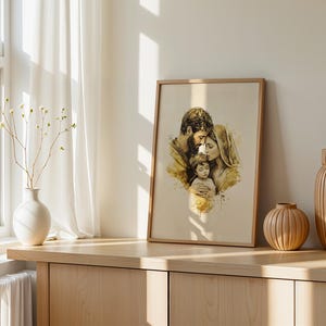 May include: A framed wall art print featuring a watercolor-style illustration of a family of three, including a parent with a beard, a parent with a head covering, and a young child, all rendered in soft shades of brown, gold, and cream.