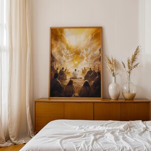 May include: A framed rectangular wall art print depicting a group of figures gathered in a desert landscape under a bright golden sky with winged beings. The artwork is displayed on a wooden sideboard next to two glass vases containing dried plants.
