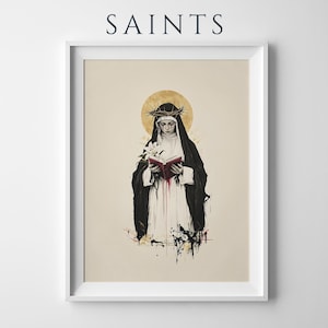 May include: A framed art print titled SAINTS featuring a black and white illustration of a figure in a dark habit and white veil, wearing a crown of thorns, holding a red book and a white lily, with a gold halo and red paint splatters.