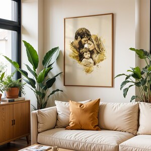 May include: A framed wall art print featuring a sepia-toned watercolor illustration of a family of three. The artwork depicts a man, a woman, and a child in a close embrace, with soft golden-brown paint splatters and washes on a cream background.