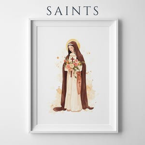 May include: A framed wall art print titled SAINTS featuring a watercolor illustration of a figure in a brown habit and white robe holding a bouquet of roses and a crucifix. The figure has a gold halo and stands against a light tan background.