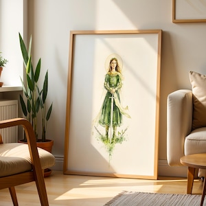 Op de afbeelding: Een ingelijste verticale kunstdruk met een aquarelillustratie van een figuur in een lange groene jurk die een hoog zwaard vasthoudt. De figuur heeft een gouden halo achter het hoofd en staat te midden van gebroken kettingen en groen blad.