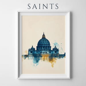May include: A framed wall art print featuring a watercolour illustration of St. Peter's Basilica in shades of blue and gold against a cream background. The word SAINTS is printed in black capital letters above the framed architectural image.