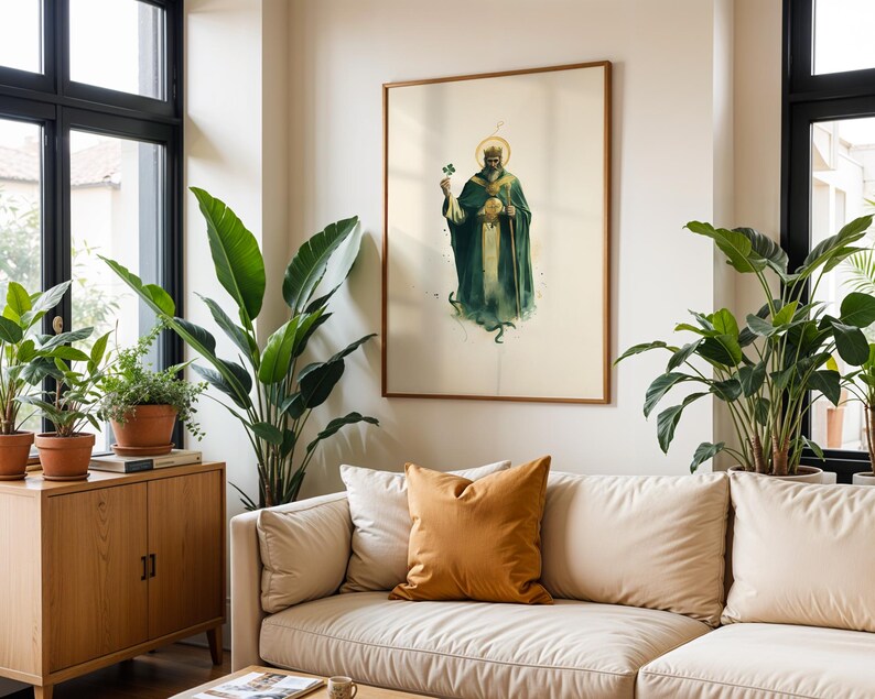 May include: A framed wall art print featuring a bearded figure wearing a crown and a long dark green robe, holding a staff and a green shamrock. The figure has a golden halo behind the head and is depicted against a plain off-white background.