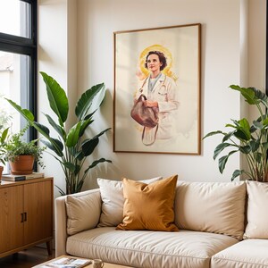 May include: A framed wall art print featuring a watercolor-style illustration of a person in a white medical coat with a stethoscope around their neck, holding a brown bag, with a soft yellow halo effect behind their head against a light background.