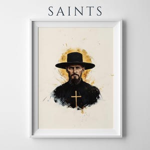 Puede incluir: Una l&aacute;mina de arte enmarcada titulada SAINTS que presenta un retrato al estilo acuarela de una figura barbuda con un sombrero negro de ala ancha y ropa negra con un emblema de cruz dorada, sobre un fondo crema con salpicaduras doradas.
