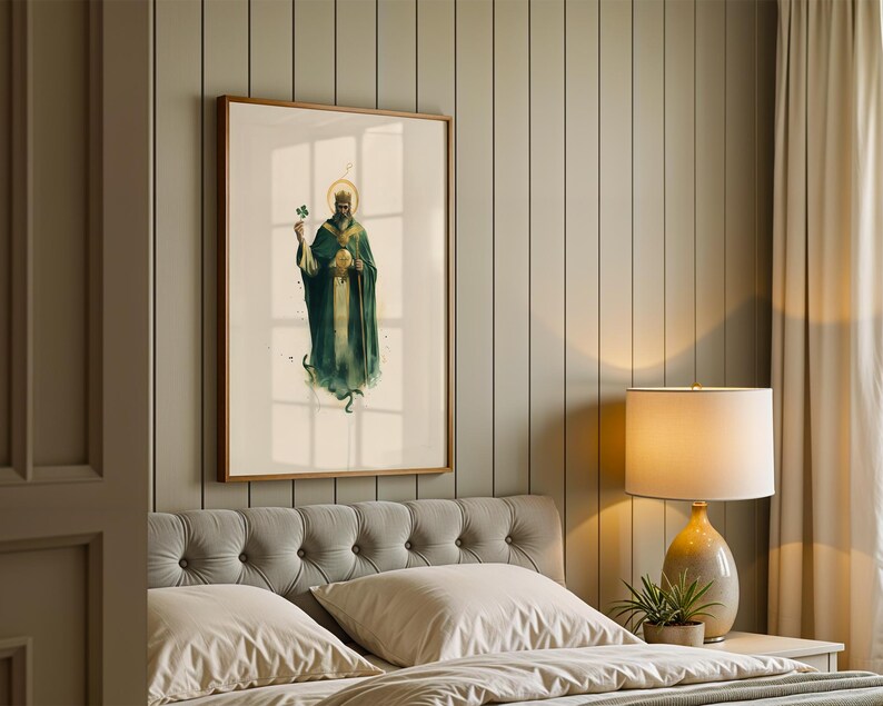 May include: A framed wall art print featuring a watercolour-style illustration of a bearded figure wearing a crown and a long dark green robe, holding a shamrock in one hand and a staff in the other, set against a light cream background.