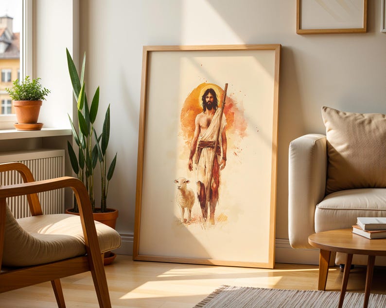Peut inclure: Une impression d'art encadr&eacute;e de style aquarelle repr&eacute;sentant une silhouette barbue aux cheveux longs, v&ecirc;tue d'un tissu drap&eacute; et portant un b&acirc;ton en bois, accompagn&eacute;e d'un petit agneau. L'&oelig;uvre pr&eacute;sente un fond halo circulaire orange.