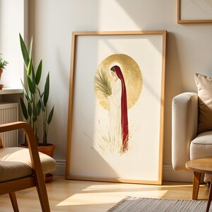 Puede incluir: Una l&aacute;mina de arte enmarcada con una ilustraci&oacute;n estilizada de una figura con t&uacute;nica blanca y una larga capa roja, sosteniendo una palma. La figura est&aacute; centrada sobre un gran halo circular dorado y texturizado con hierba dorada.