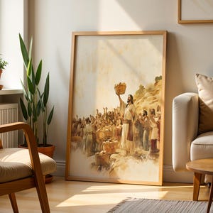 K&ouml;nnte beinhalten: Ein gerahmter Kunstdruck mit einer Aquarell-Illustration einer in Gew&auml;nder gekleideten Figur, die einen Korb &uuml;ber eine Menschenmenge h&auml;lt. Die Szene zeigt eine Versammlung mit mehreren Brotk&ouml;rben in warmen, gedeckten Beige-, Braun- und Goldt&ouml;nen.