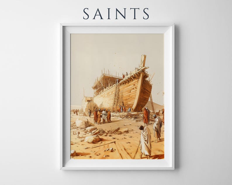 May include: A framed art print titled SAINTS featuring a sepia-toned illustration of a large wooden ship under construction in a desert landscape. Several figures in robes stand near the vessel, which is surrounded by scaffolding and scattered rocks.