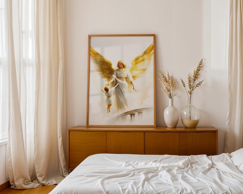 May include: A framed wall art print featuring a painting of a large angel with expansive golden wings reaching down to hold the hand of a small child. The angel wears a flowing white robe, and the scene is set against a soft, light background.