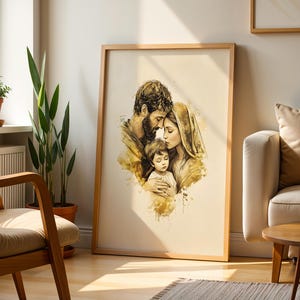 May include: A framed wall art print featuring a watercolor-style illustration of a family of three. The artwork depicts a bearded person, a person with a head covering, and a young child in shades of gold, brown, and cream on a light background.
