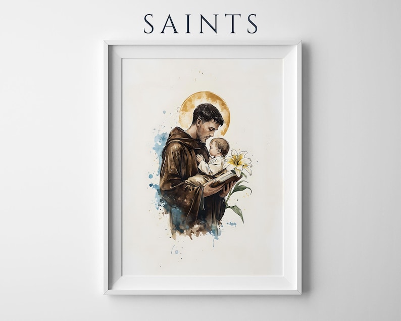 Puede incluir: Una l&aacute;mina de arte mural enmarcada con el texto SAINTS en la parte superior. La ilustraci&oacute;n muestra a una figura con t&uacute;nica marr&oacute;n sosteniendo a un ni&ntilde;o peque&ntilde;o y un libro, con un halo amarillo, un lirio blanco y salpicaduras de acuarela azul.