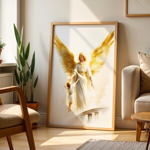 May include: A framed wall art print featuring a large angel with expansive golden wings wearing a white robe, reaching down to hold the hand of a small child who is walking toward a bridge. The artwork uses soft, ethereal light and warm tones.