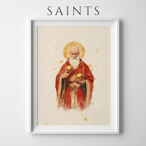 May include: A framed wall art print featuring the word SAINTS at the top. The illustration depicts a bearded figure in a red robe with a gold halo, holding two golden spheres. The artwork has a watercolour style with light beige background.
