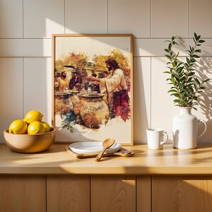 May include: A framed watercolor-style print depicting a biblical scene with figures gathered around large clay jars, set in a light-toned kitchen. The artwork features warm earth tones, including browns, yellows, and reds, capturing a narrative moment.