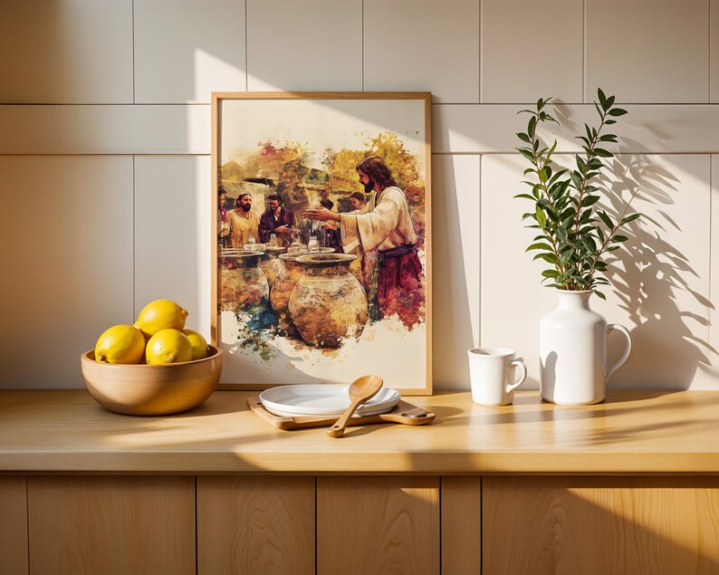 May include: A framed watercolor-style print depicting a biblical scene with figures gathered around large clay jars, set in a light-toned kitchen. The artwork features warm earth tones, including browns, yellows, and reds, capturing a narrative moment.