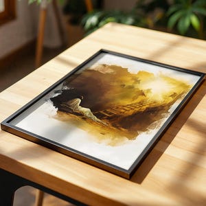 Op de afbeelding: Een rechthoekige ingelijste print met een illustratie in aquarel-stijl van een figuur in een wit gewaad die bij een houten ladder zit die naar een helder, stralend licht leidt. Het kunstwerk gebruikt tinten bruin, goud en wit op een witte achtergrond.