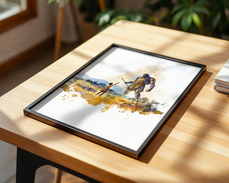 May include: A framed art print featuring a watercolour-style illustration of a small figure reaching towards a large, muscular, armoured giant in a golden-hued landscape. The artwork is enclosed in a thin black frame, showcasing a dynamic scene with expressive brushstrokes and a warm colour palette of yellows, browns, and blues.