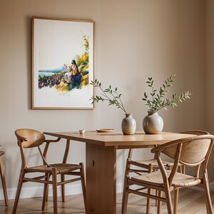 May include: A framed watercolour-style print depicting a figure in robes addressing a large crowd near a body of water, mounted on a beige wall above a wooden dining table with two ceramic vases, four wooden chairs, and a small wooden stool.