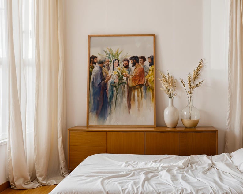 May include: A framed vertical wall art print depicting a watercolor scene of a central female figure in a white veil holding yellow lilies, surrounded by a group of men in robes. The artwork features soft brushstrokes and muted earth tones.