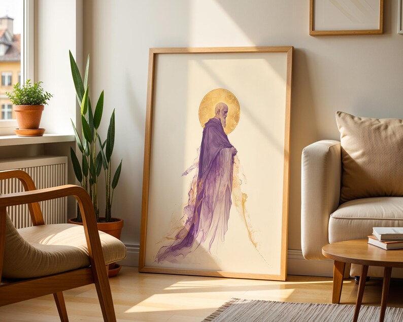 May include: A framed vertical art print featuring a side profile of a bearded figure with a golden halo, wearing a flowing purple robe that dissolves into abstract wisps at the bottom. The artwork is set against a light cream background.