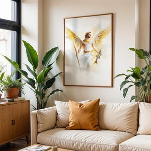 May include: A framed wall art print featuring a central figure with large golden wings, wearing a white robe, holding a long staff in the right hand and a fish in the left hand, set against a soft, ethereal, light-filled background.