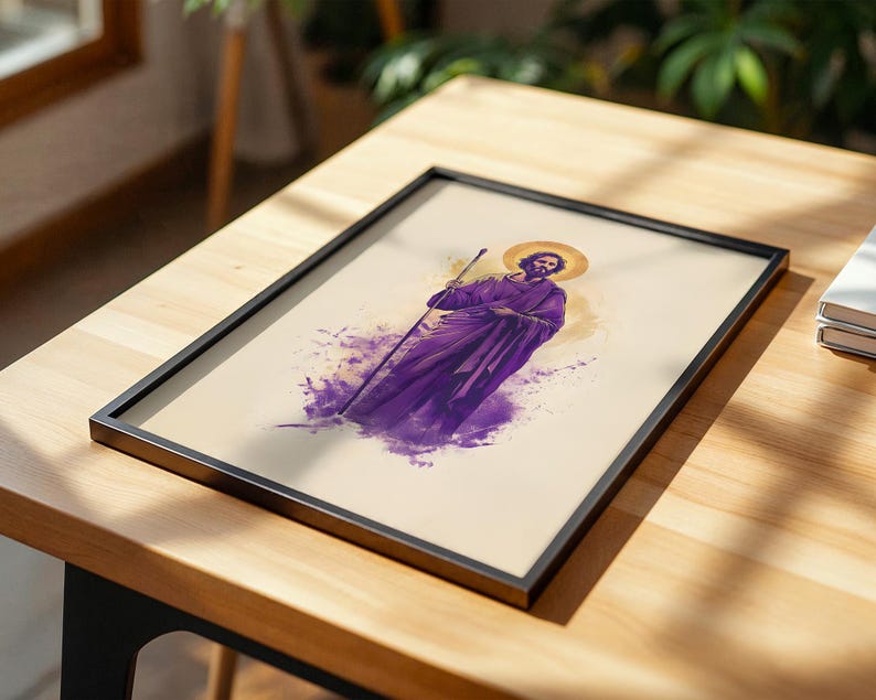 May include: A framed print featuring a stylized illustration of a bearded figure wearing purple robes and holding a staff. The figure has a golden halo behind their head, set against a cream-colored background with purple watercolor-style splashes.