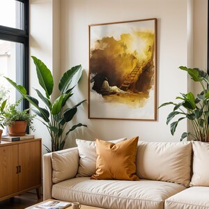 Op de afbeelding: Een ingelijst rechthoekig kunstwerk aan de muur met een abstract aquarel in warme tinten van een figuur die rust bij een ladder die naar een heldere, gloeiende lichtbron leidt, weergegeven in een houten lijst aan een muur.