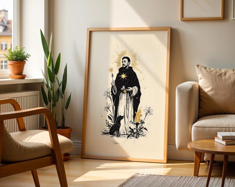 May include: A framed wall art print featuring a black and white illustration of a robed figure with a golden halo, a star on the chest, and a dog at their feet. The artwork includes floral elements and a flame, all set against a cream background.