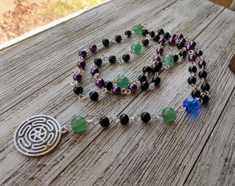 Hekate Rosary with Stropholos (Wheel of Hekate), Purple & Black Glass Beads, Royal Blue Glass Connector, and Green Aventurine Accent Beads
