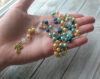 Christian Rosary with Golden Cross, Pansy Connector, Pale Yellow and Aqua Blue Glass Pearls, Teal Painted Wood Beads, & Opalite Crystals