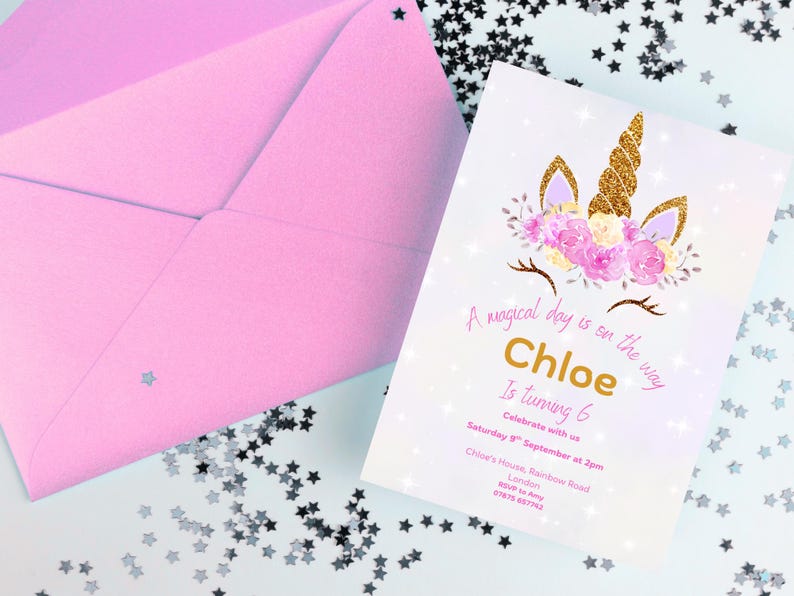 May include: A pink envelope and a birthday invitation with a unicorn design. The invitation has gold text that reads "Chloe Is Turning 6" and includes event details. The invitation is decorated with floral and glitter accents.