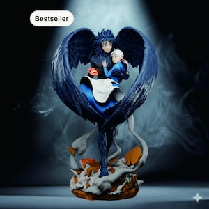 May include: A detailed figurine of two anime characters embraced within large, dark blue wings. The male character has dark hair and is holding a red object. The female character has white hair and is wearing a blue dress. The base is a mix of orange and white.